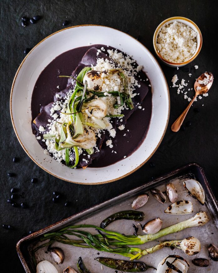 A plate of Chicken Enfrijolada