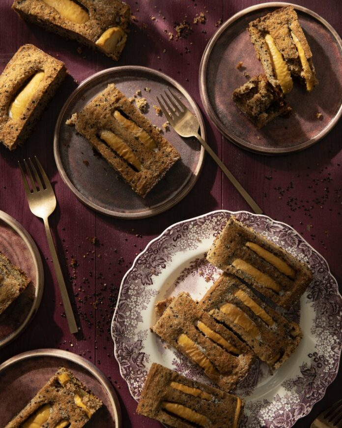 Three plates holds slices of Apple Bourbon Quinoa Cake on a burgundy table.