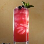Cool off with a tall cocktail that tastes like summer in this blueberry lavender buck.