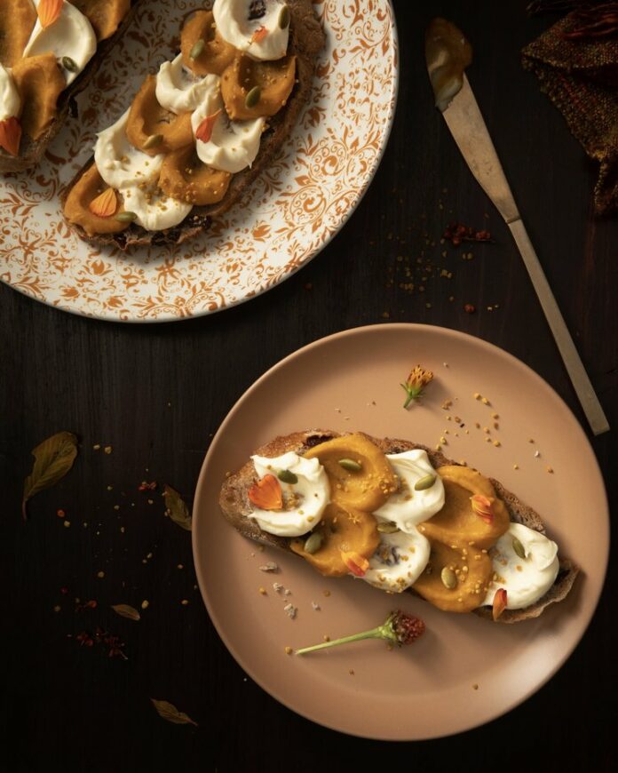 Pieces of bread are layered with alternating roasted squash tartine and honey mascarpone.