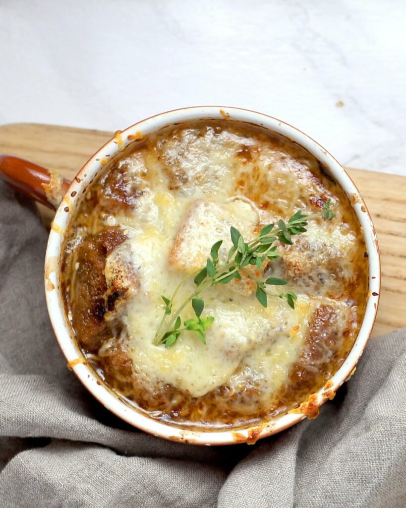 A large bowl of french onion soup.