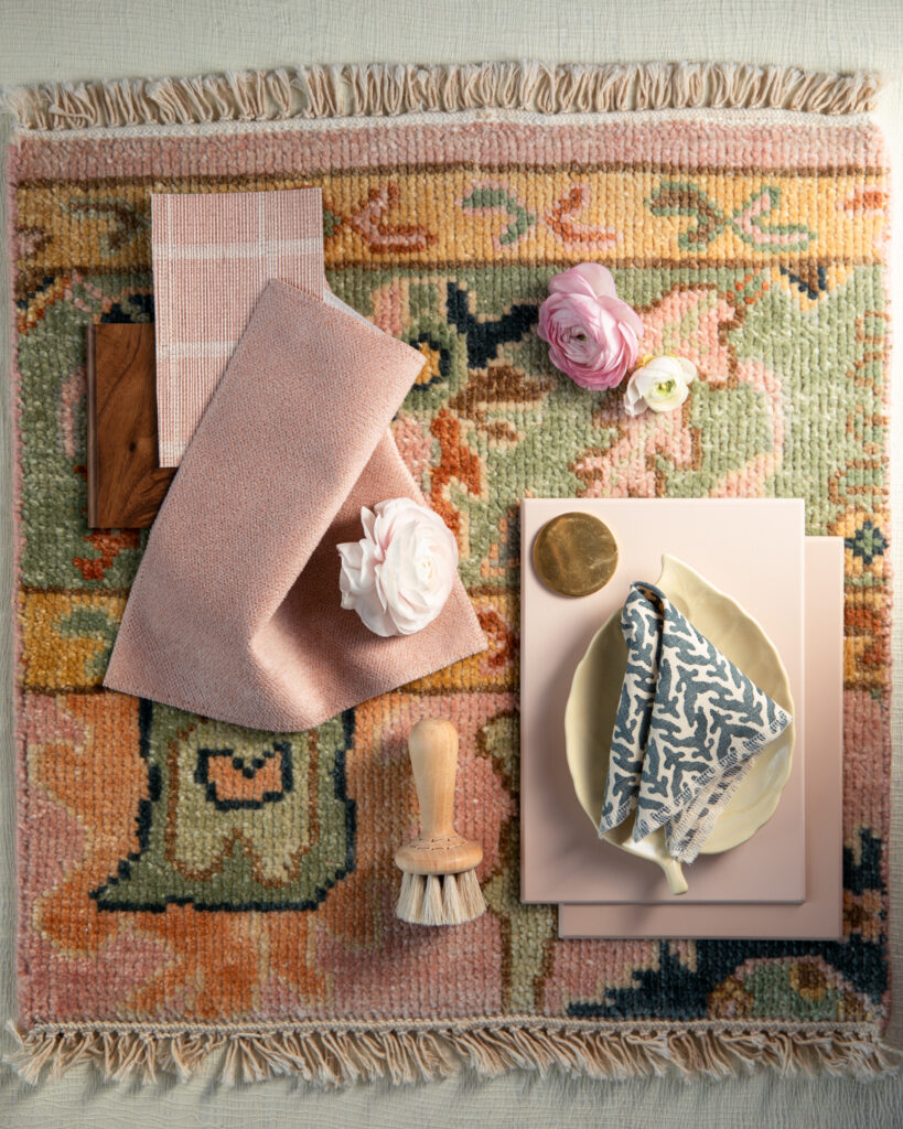 A flat-lay of home items in rose and pink colors for a color design article. 