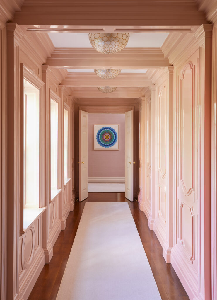 A photo of a hallway painted peachy pink for a color design article.