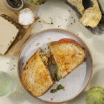 A Goat Rodeo grilled cheese sandwich on a plate.