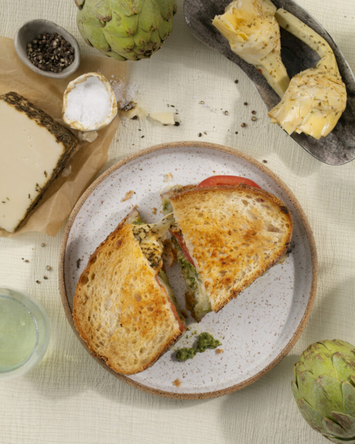 A Goat Rodeo grilled cheese sandwich on a plate.
