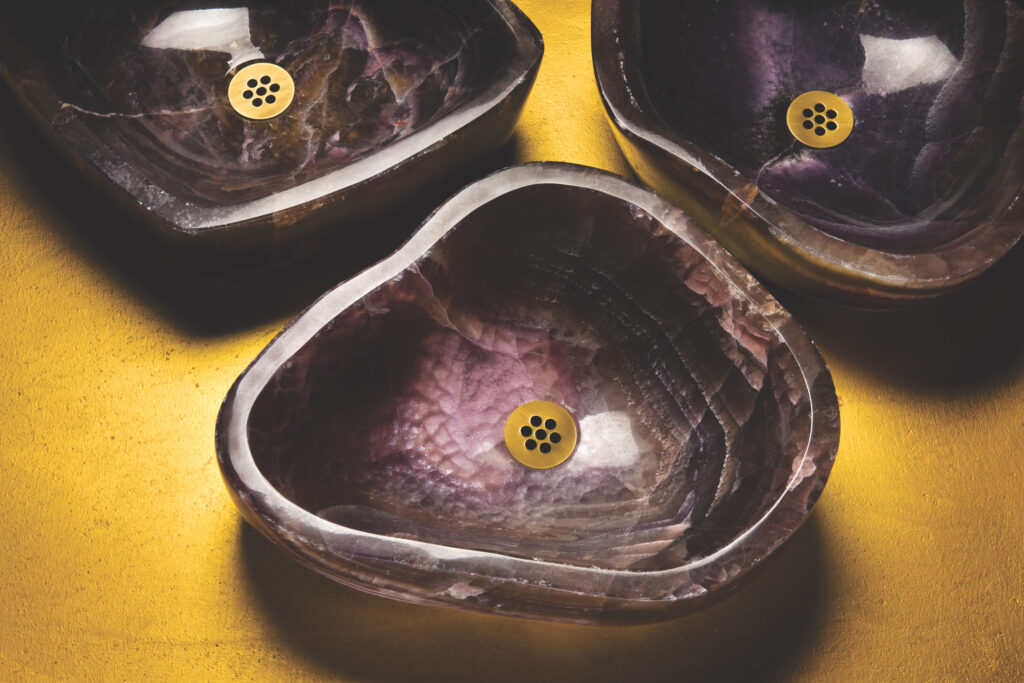 A photo of purple-colored sinks by Stone Forest.