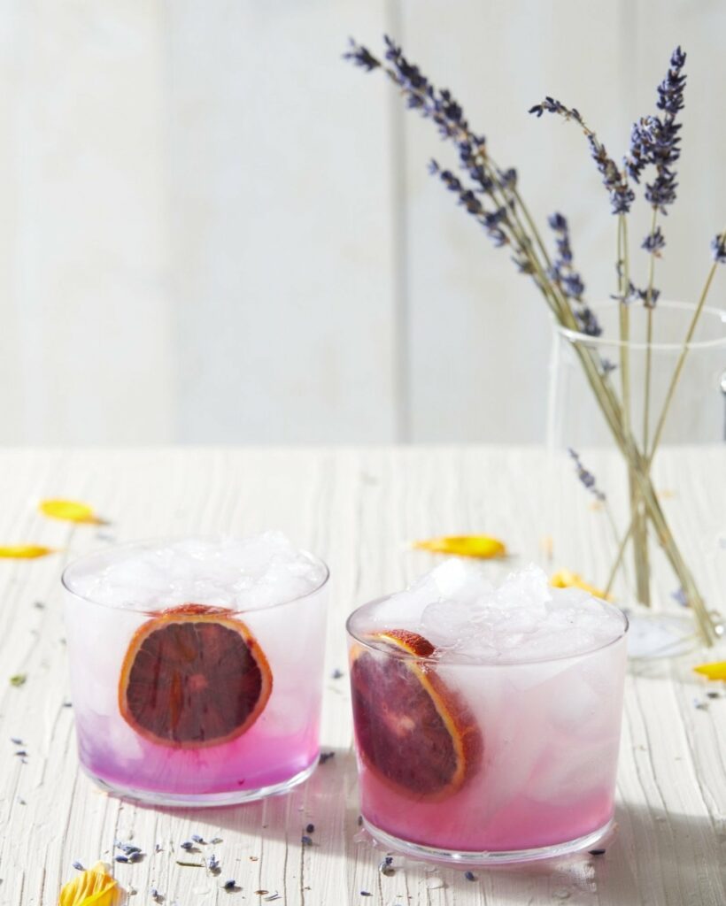 a gin cocktail with a dash of purple