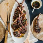 Grilled lamb chops with herb garnish