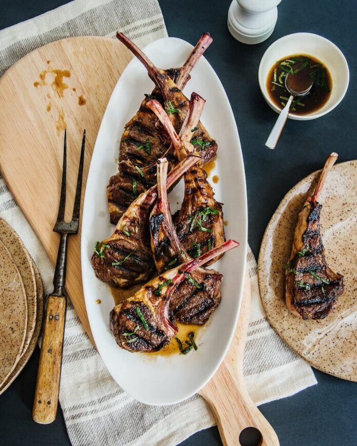 Grilled lamb chops with herb garnish