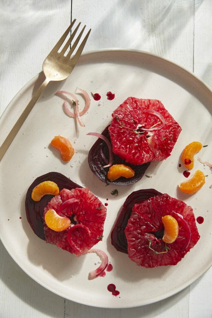 Braised Beet and Grapefruit Salad Braised Beet and Grapefruit Salad on a white plate with a steel fork at the corner