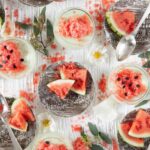 Lime Posset & Watermelon Granita in small glass dishes with spoons.