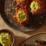Soba noodles tossed in vindaloo sauce, arranged in nests and topped with edamame puree.