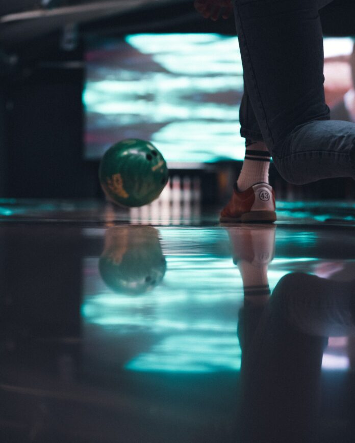 A bowling ball flies down the bowling lane, places to feel like a kid