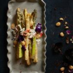 Crispy and Delicious Asparagus Tempura on a grey platter with a king crab salad.