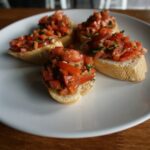Classic Tomato Bruschetta served on a plate