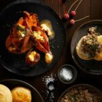 Tender baby yams with maple-chipotle compound butter, offering a delightful combination of sweet and smoky flavors, perfect for adding a touch of indulgence to your meal.