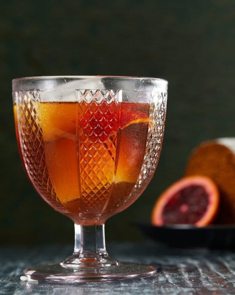 The Revolver is a bold and sophisticated whiskey cocktail with a balanced blend of rich bourbon, aromatic coffee liqueur, and a touch of zesty orange bitters, garnished with an orange twist.