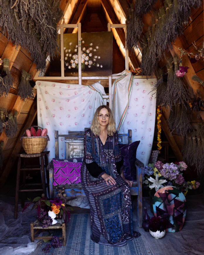 Seated woman with flowers, crafts, and dried lavender, Lisa Fontanarosa