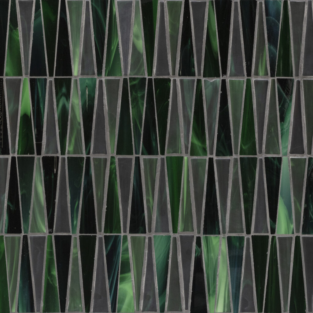 Gorgeous emerald tones in syncopated trapezoidal forms. An intriguing interplay between glossy and matte finishes. 