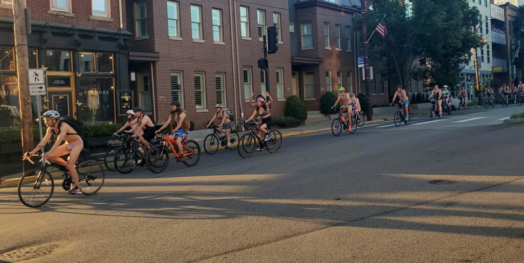 multiple people on bikes wearing their underwear ride through a city. events in pittsburgh