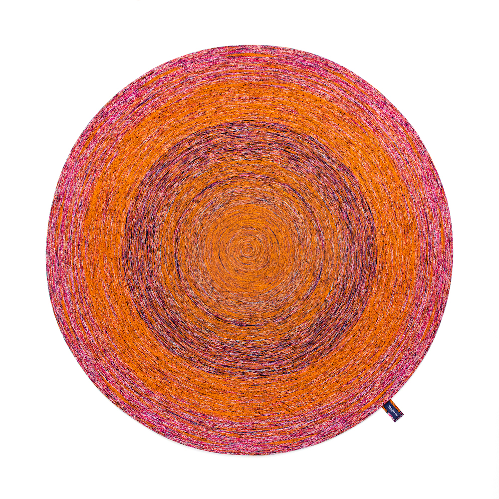 a recycled round carpet featuring intriguing, beautifully mixed colorways.
