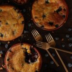 A delectable image of a berry cobbler dessert from Eighty Acres Kitchen.