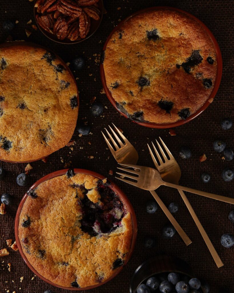 A delectable image of a berry cobbler dessert from Eighty Acres Kitchen.