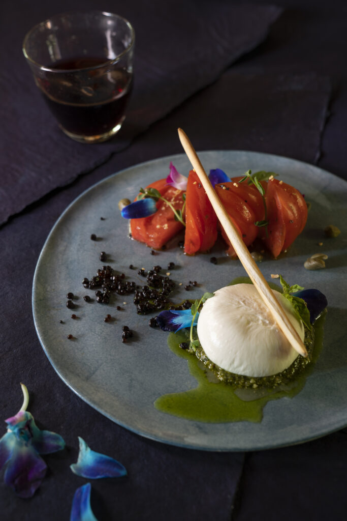 Burrata Caprese Recipe with Heirloom Tomatoes, Burrata, Tangerine Juice, and Balsamic Pearls. Santa Fe Wine & Chile Fiesta