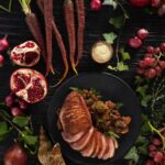 An aerial shot of Mushroom Ragout Over Garlic Crostini With Spiced Duck