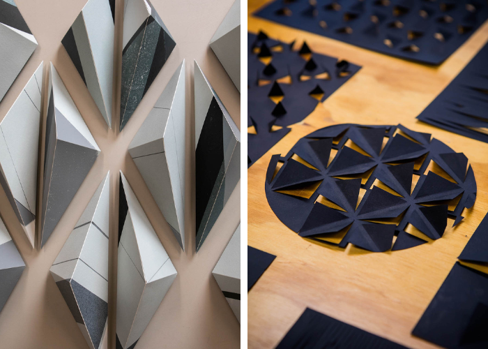 on the left, metal pieces in the shapes of 3D triangles. On the right, dark blue metal circles