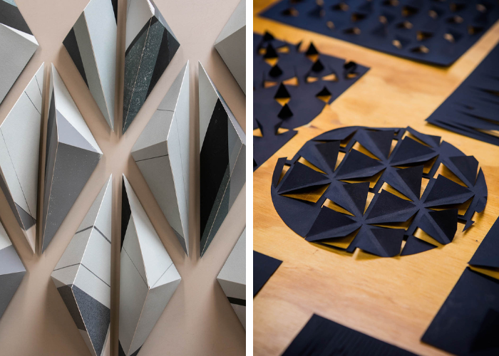 on the left, metal pieces in the shapes of 3D triangles. On the right, dark blue metal circles