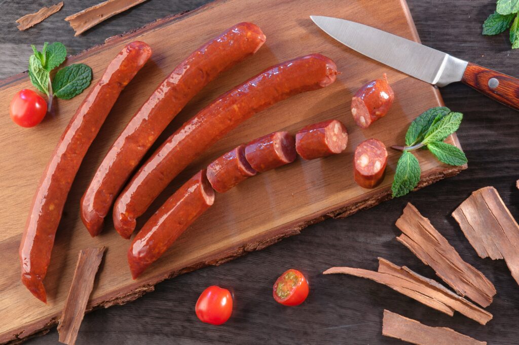 Sausages on a wooden cutting board. events in pittsburgh