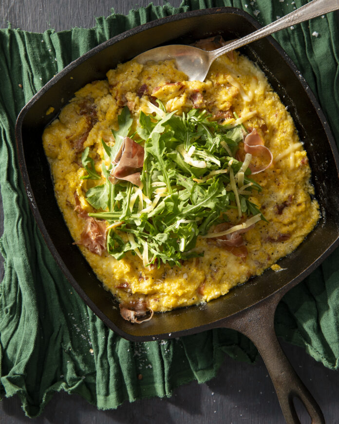 an aerial shot of Roasted Green Chile Polenta with Prosciutto and Mexican Asadero. a Polenta recipe