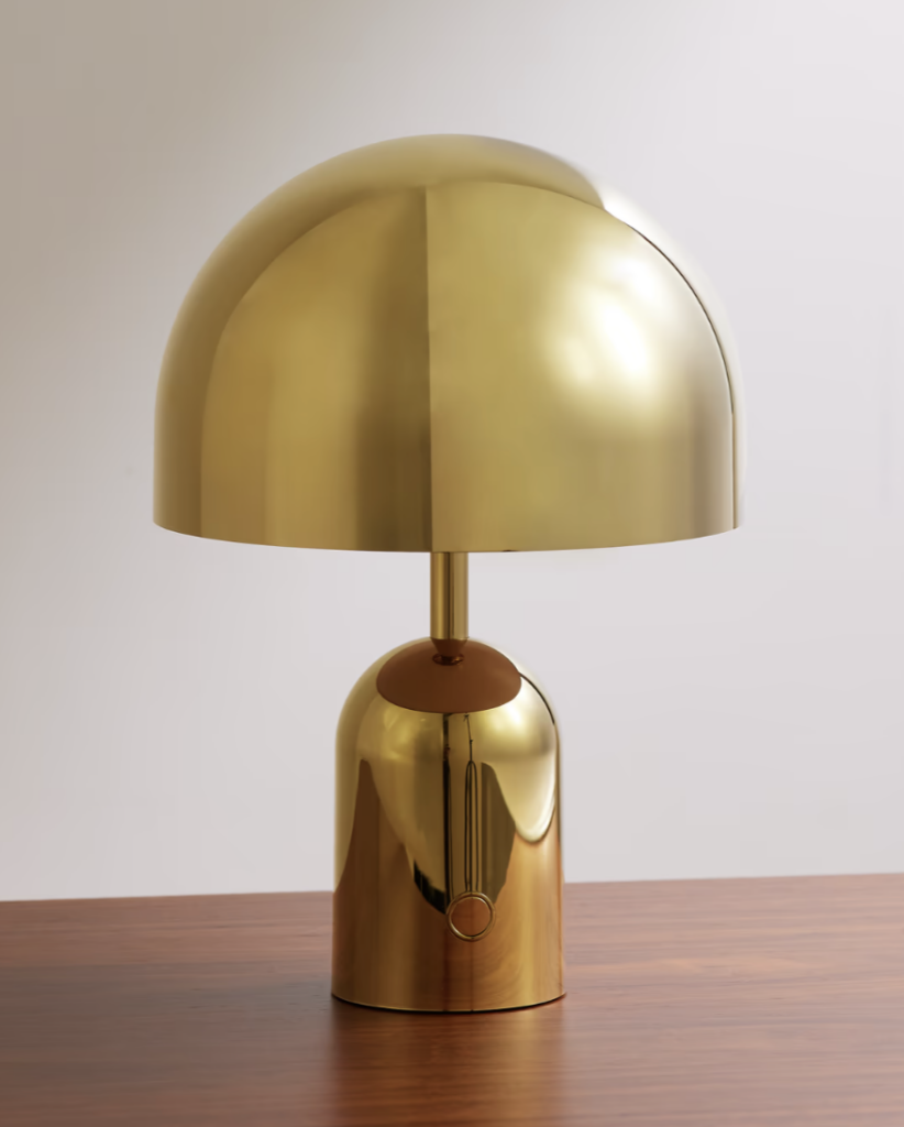 gold mushroom looking lamp. 2023 metallics trend.