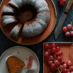 An aerial view of a Carrot Cardamom Bundt Cake with a few pieces cut out