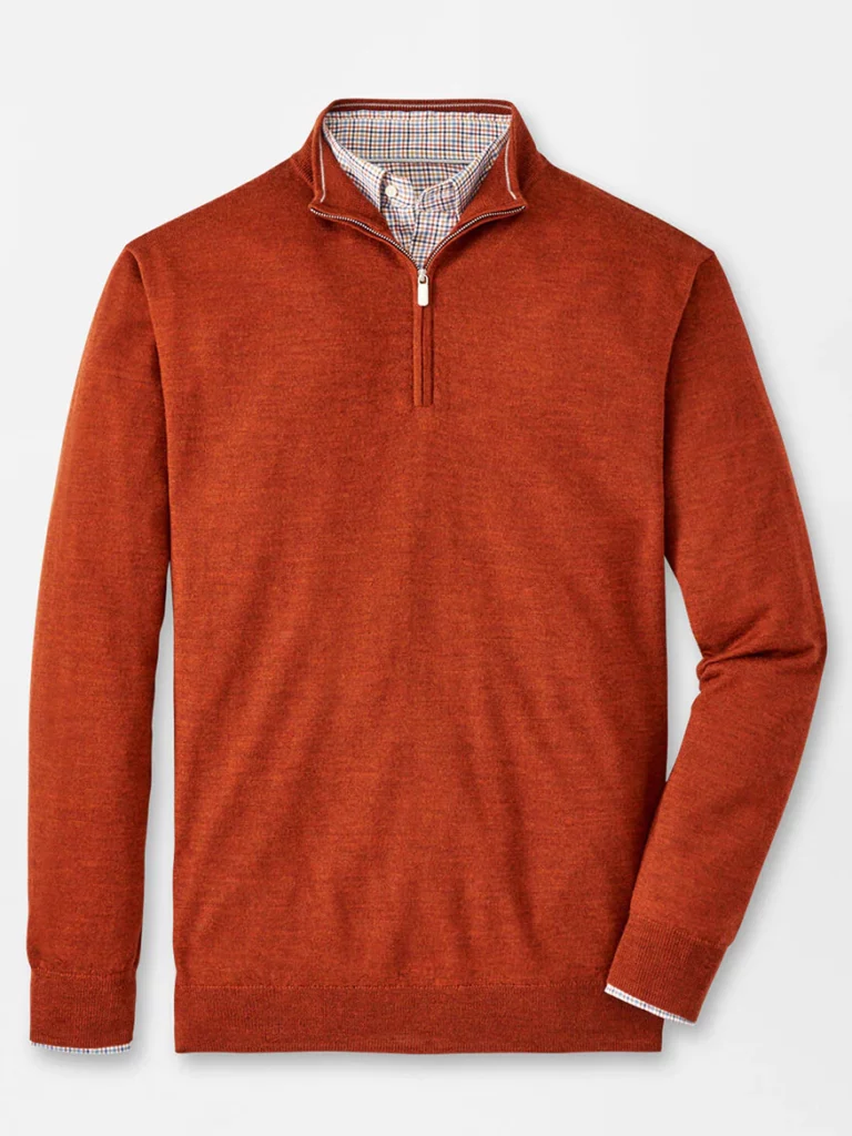 An orange/red quarter zip sweater
