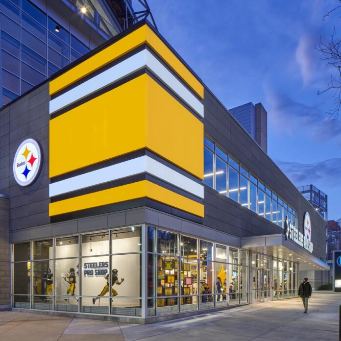 Pittsburgh Steelers Pro Shop building lit up at night.