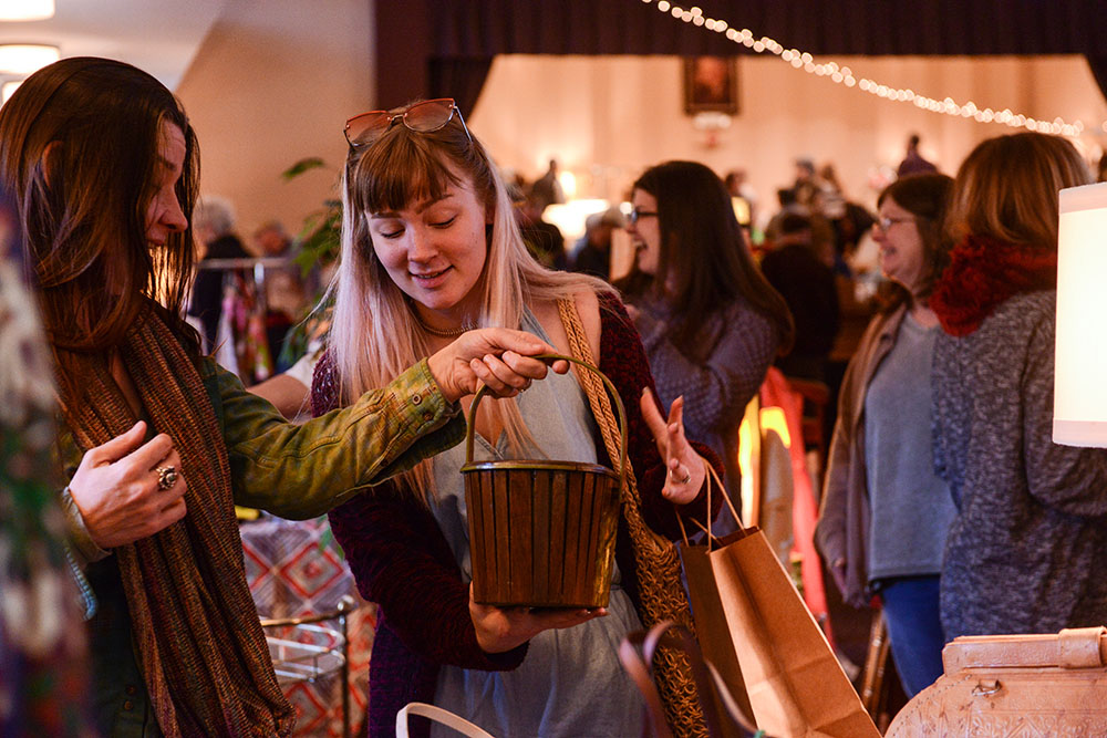 Two women look at a vintage ware at the Pittsburgh Vintage Mixer