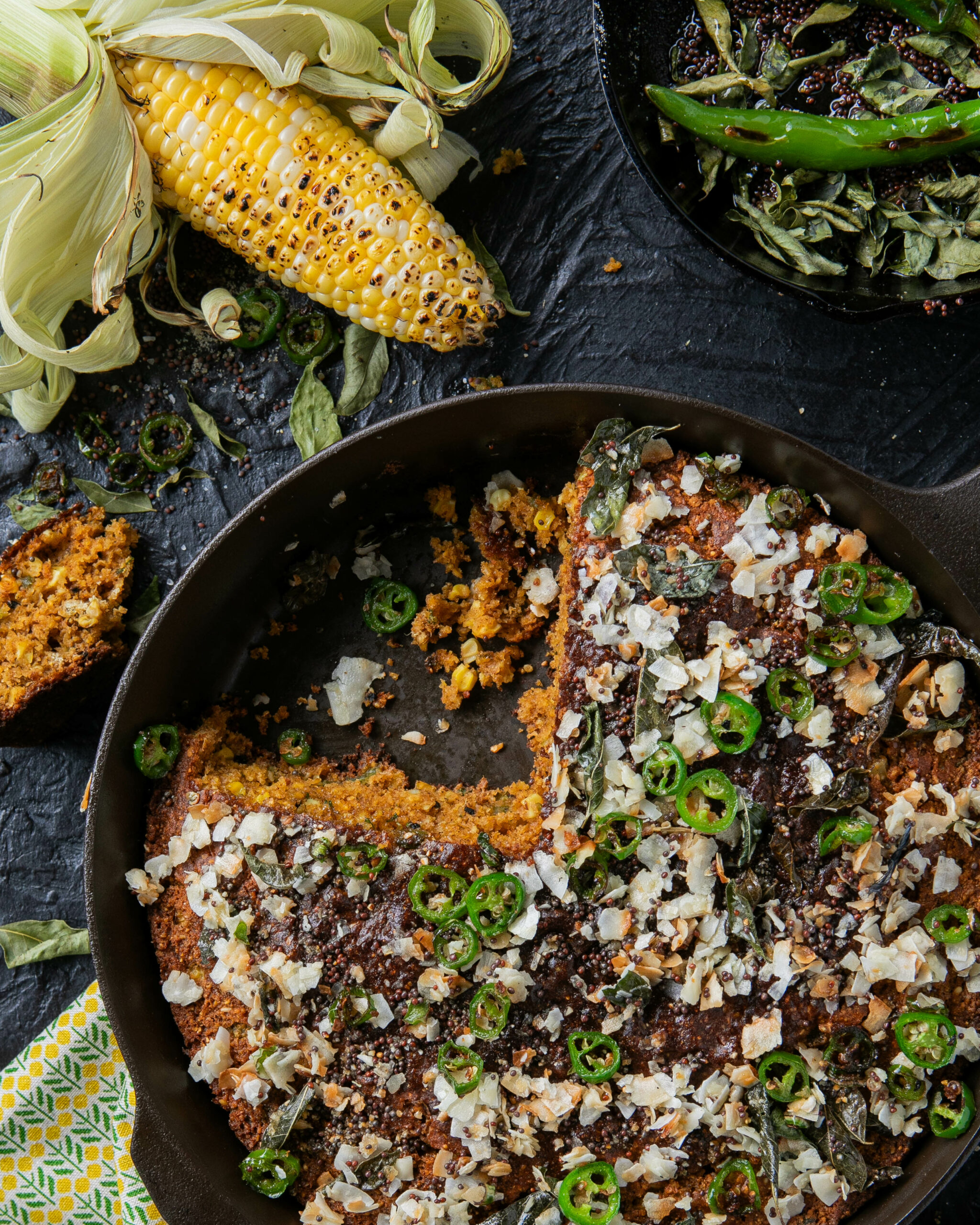 A delectable and unique cornbread recipe by Vishwesh Bhatt, featuring roasted corn, charred jalapeños, and a medley of spices. Baked to perfection in a cast-iron skillet, this flavorful Southern classic with Gujarati influences is a culinary delight.