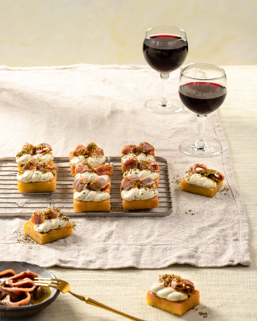 Panelle, Hand-Dipped Ricotta, and Anchovies. Accompanied by the Indigenous Red Varietal, Caruso e Minini Terre Siciliane Perricone Naturalmente Bio from Tina’s Bottle Shop.