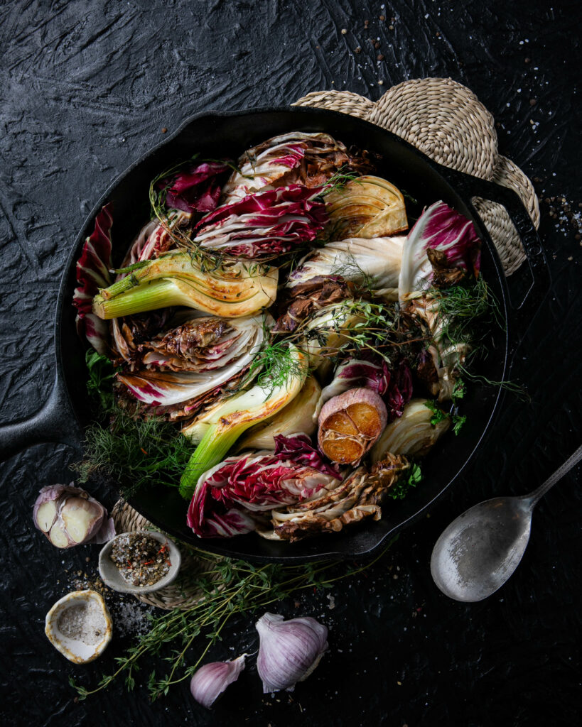 Braised Fennel and Radicchio in a Butter Pat cast-iron skillet with vermouth, showcasing a perfect blend of caramelization and mellow richness. Fresh herbs garnish this delightful side dish.