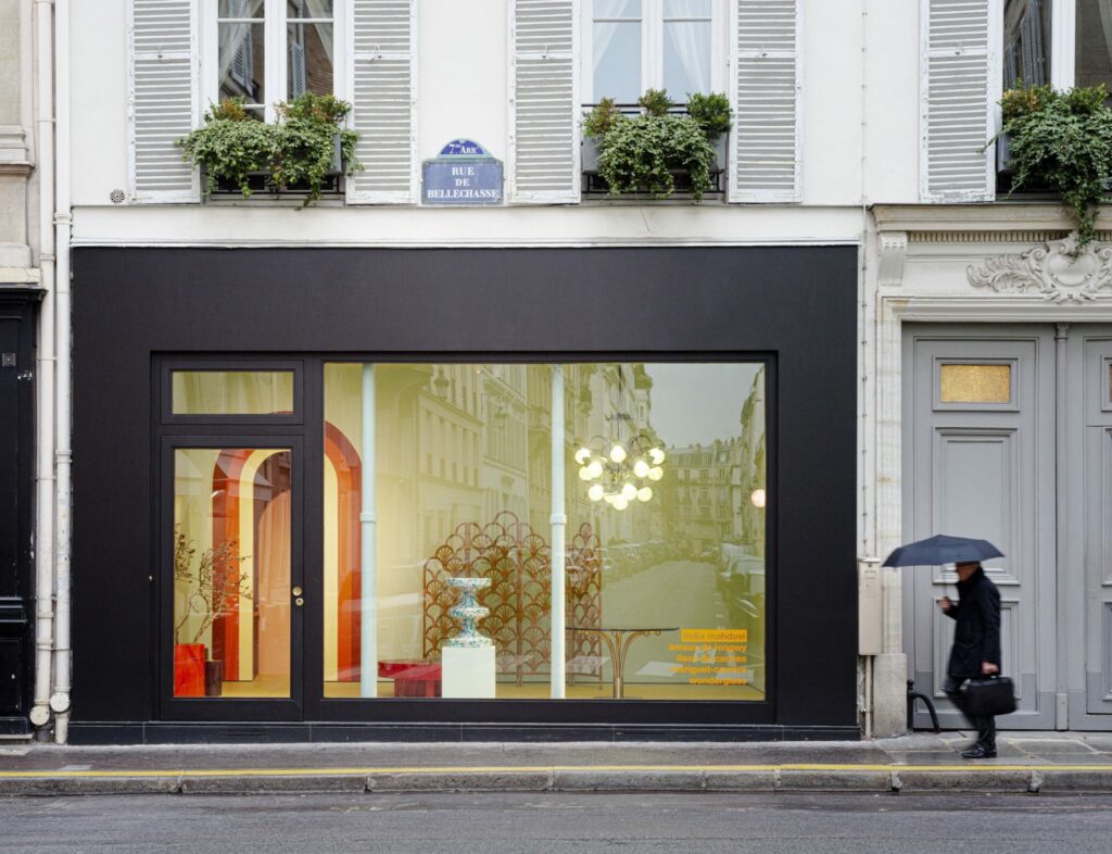 The store front window looking into India Mahdavi design shop on the streets of Paris
