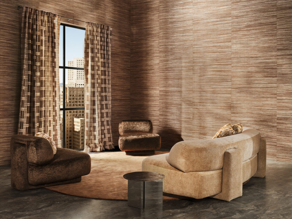 A living room is shown in different shades of brown with a couch, curtains, and pillows.