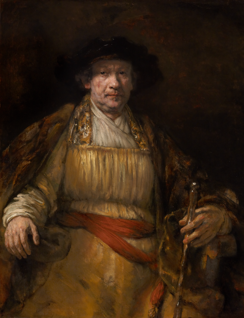 A painting of a man dressed in royal gold clothing sits on a chair with a hat on his head by Rembrandt at The Frick Pittsburgh.