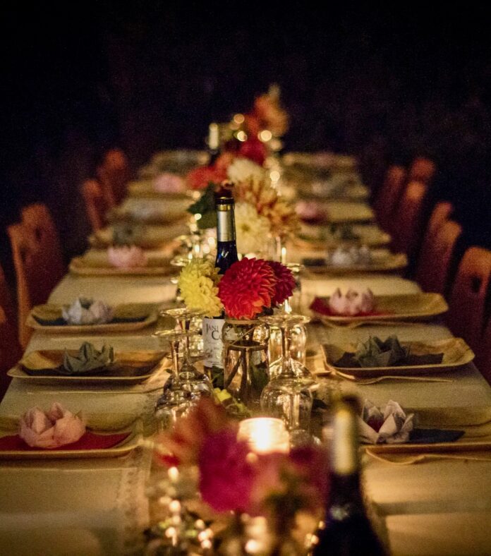 A set of wines and plates on an Easter dinner table