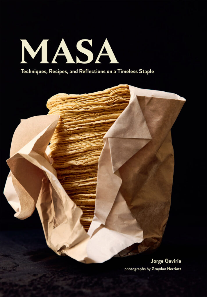 A book cover for the book masa by Jorge Gaviria that features a black background behind a stack of masa tortillas.