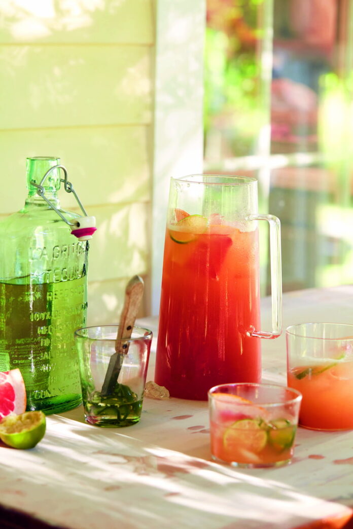 Spicy-Paloma-Punch Spicy Paloma Punch - Refreshing tequila-based batch cocktail with grapefruit, lime, and jalapeño syrup, served in a pitcher.