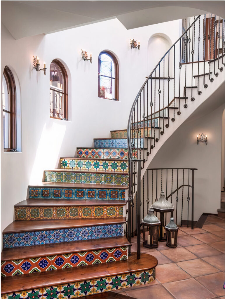 A staircase is embellished in multi-patterned and colored tiles.