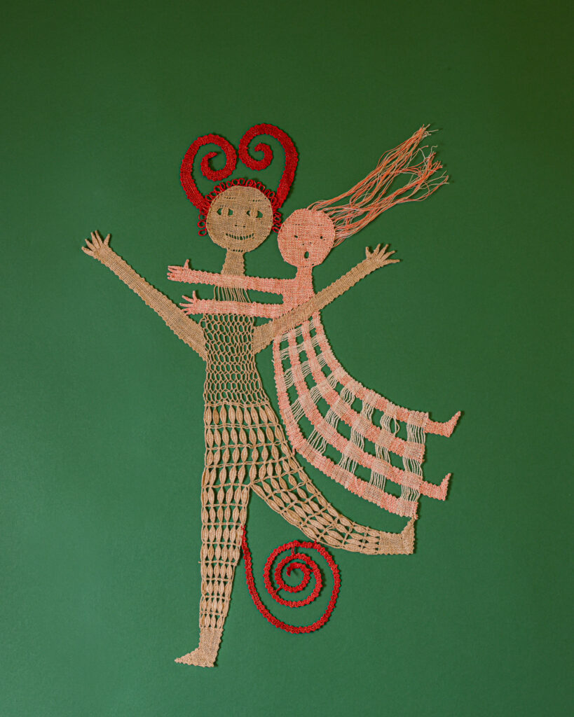 An old art piece of an illustrated devil having a girl cling to him against a green background.
