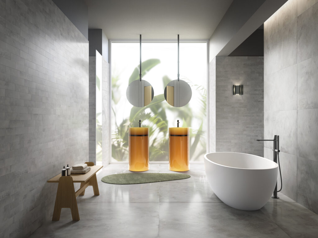 A minimalist bathroom in beige and neutral designs with a white tub to the right.